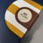 A/5 sötétkék - barna - okker csíkos napló cserélhető belívvel